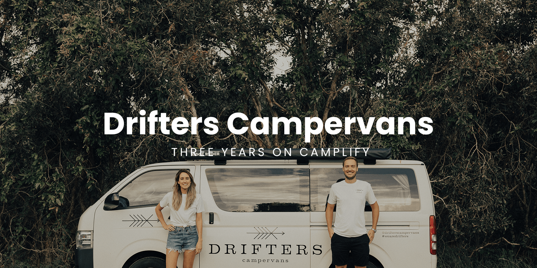 Drifters campervan parked at a sunny coastal campsite, ready for adventure.