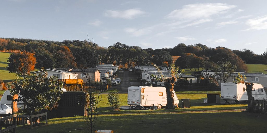 Static caravan at a sunny caravan park, perfect for a budget-friendly holiday.