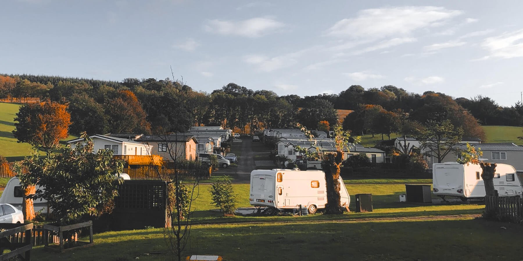 Static caravan at a sunny caravan park, perfect for a budget-friendly holiday.