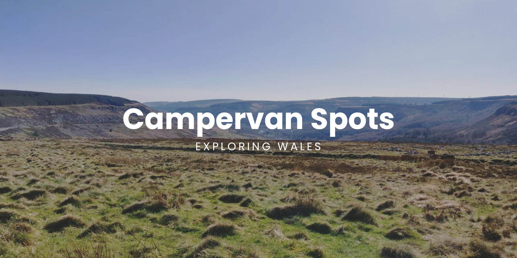 Campervan overlooking a Welsh valley, Snowdonia National Park in the distance. Perfect for a road trip.