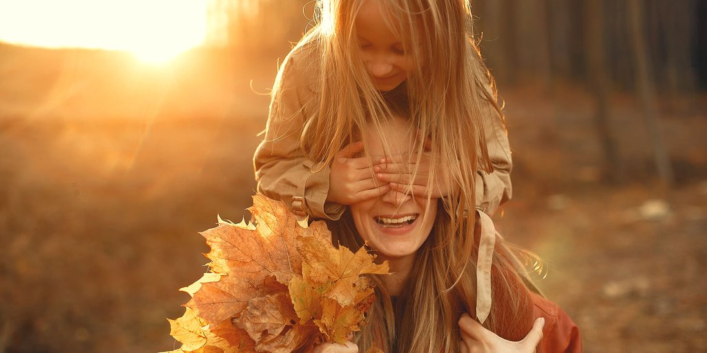 Family driving a campervan on a road trip, mountains in the background. Enjoying a summer holiday.