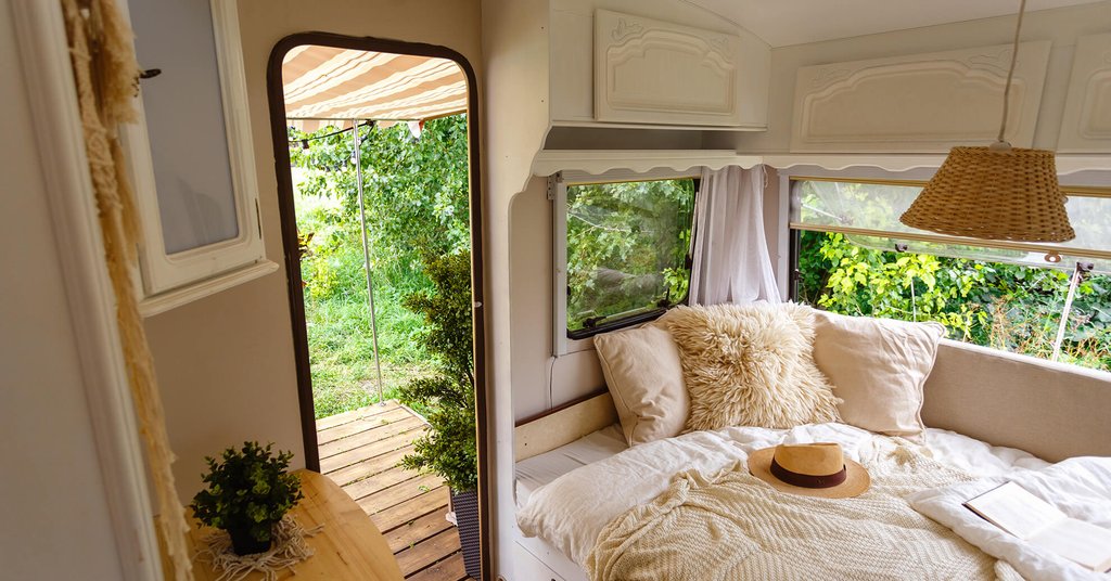 Campervan parked up at scenic spot in the UK, ready for a September glamping adventure.