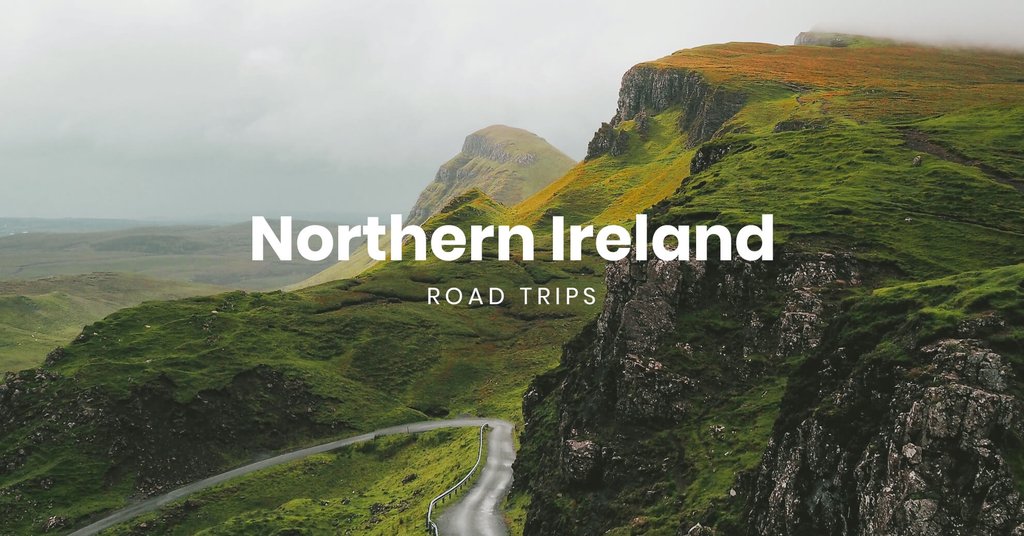 Scenic coastal road in Northern Ireland, motorhome parked overlooking dramatic cliffs.