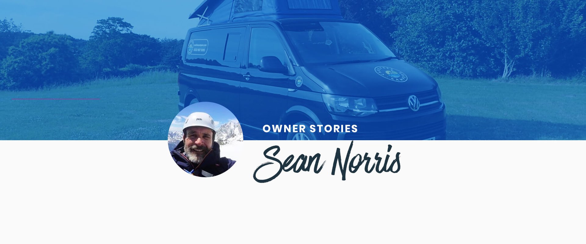 Camper van parked against a backdrop of stunning mountain scenery.