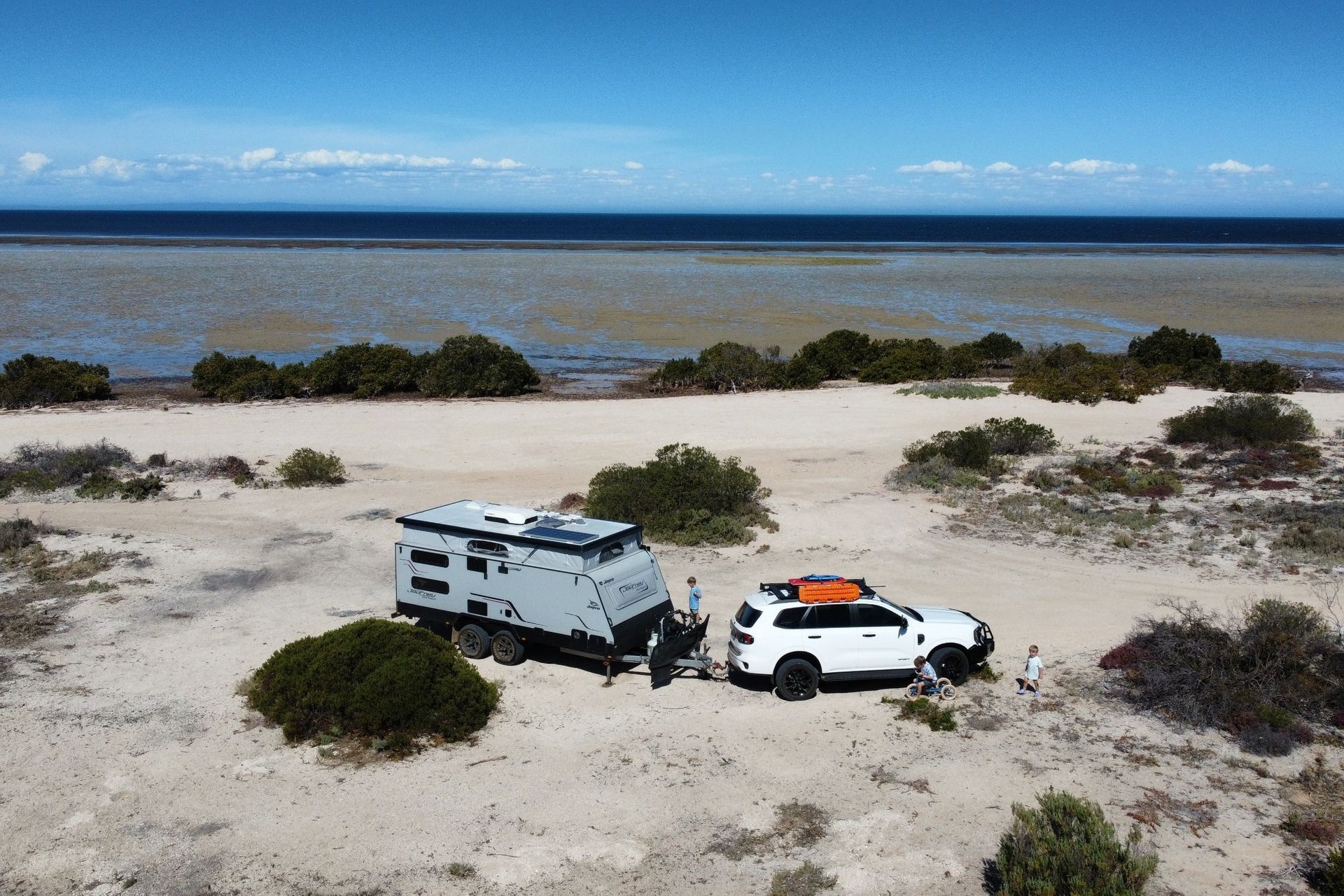Caravan setup at a bush campsite, ready for a family Aussie road trip adventure.