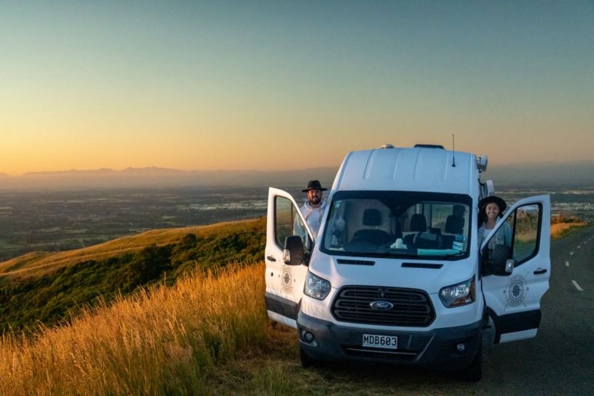 Campervan parked up at a stunning South Island campsite. Road trip adventures!