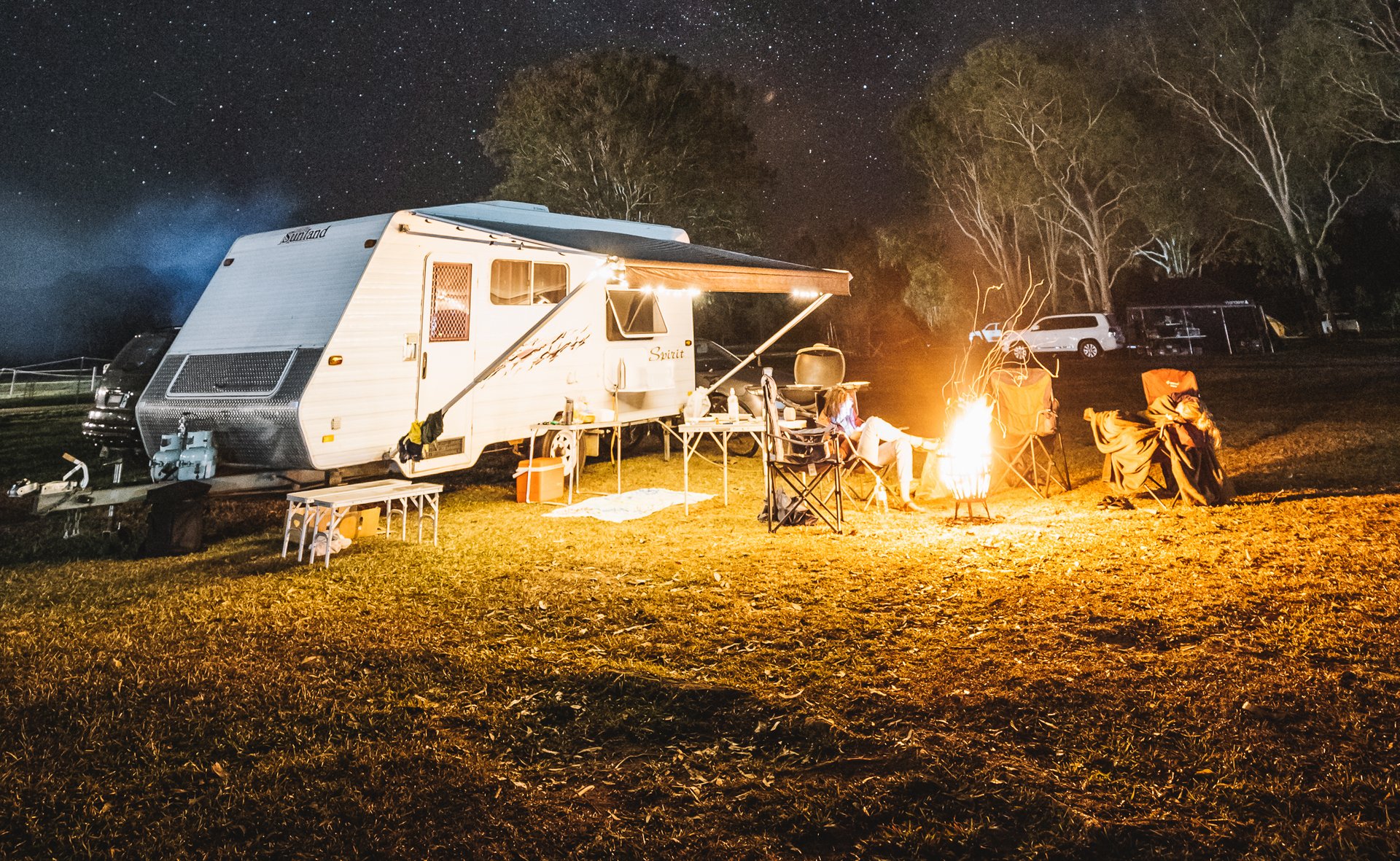 Campervan overlooking a sunny Noosa beach. Coastal vanlife adventure in Queensland.