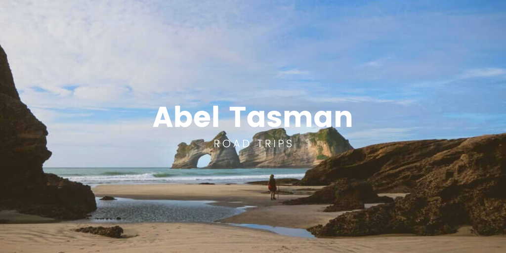 Campervan overlooking Golden Bay, Abel Tasman. Turquoise waters & lush native bush.