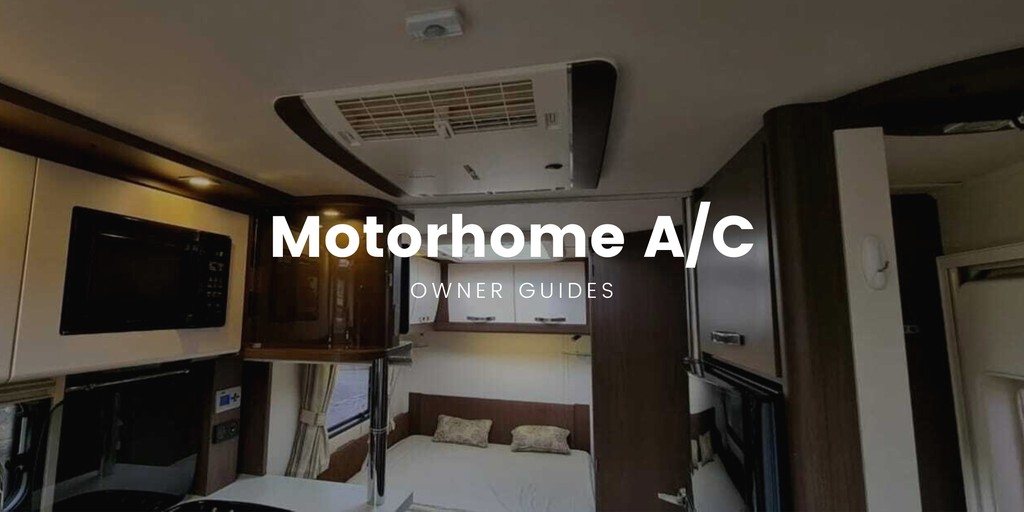 Motorhome parked up at a campsite, with sun shining and blue skies.