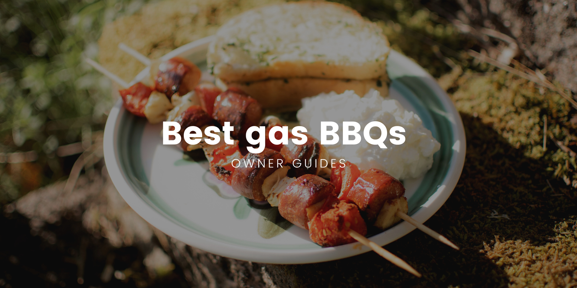 Motorhome parked by a lake, BBQ lit, family enjoying a campsite cookout.