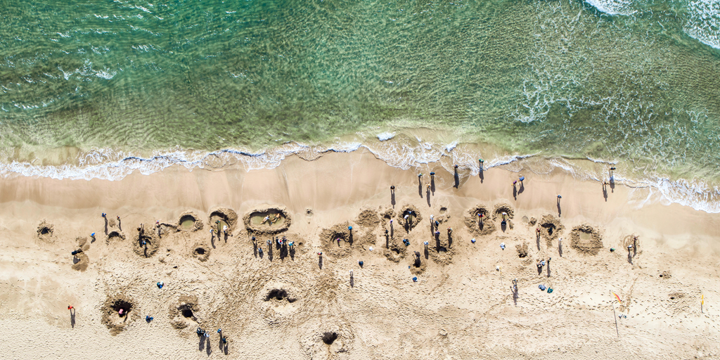 Road trip along the Coromandel coast. Campervan parked up, winter sun, blue skies.