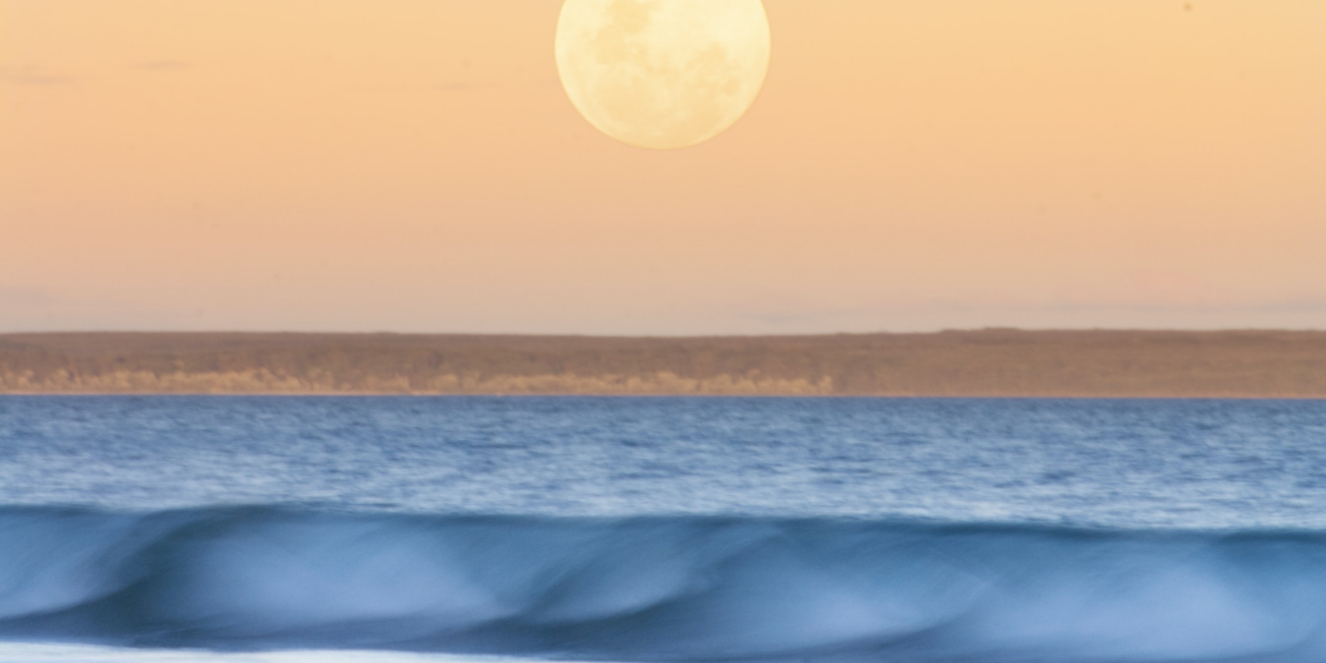 Turquoise waters meet white sand at Jervis Bay, NSW, beckoning travellers on a camping holiday.
