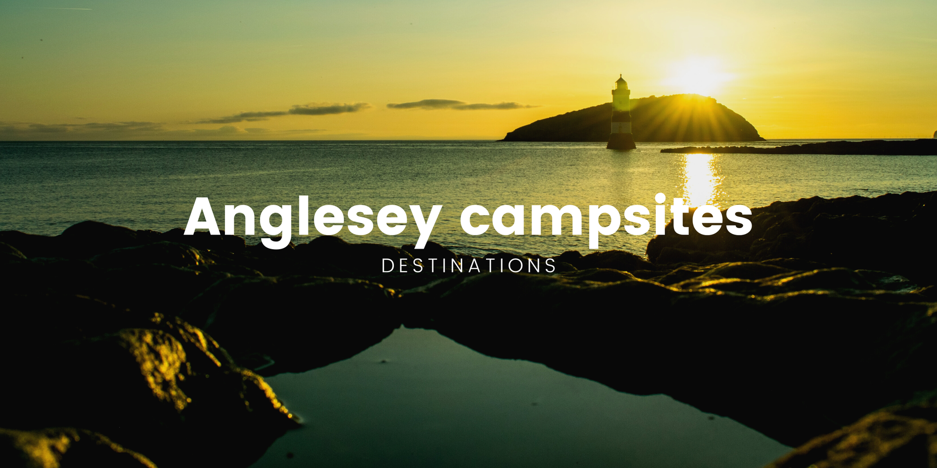 Tents pitched at Anglesey campsite overlooking the Welsh coast, North Wales holiday.