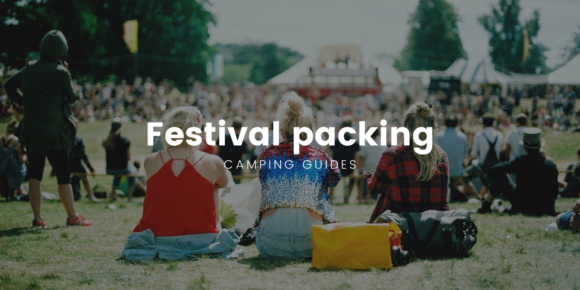 Festival campsite with tents pitched, chilly bins and people milling about.