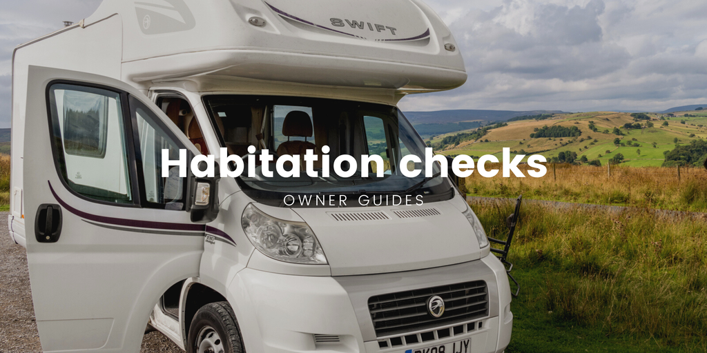 Motorhome parked up on a sunny campsite pitch, ready for a holiday.