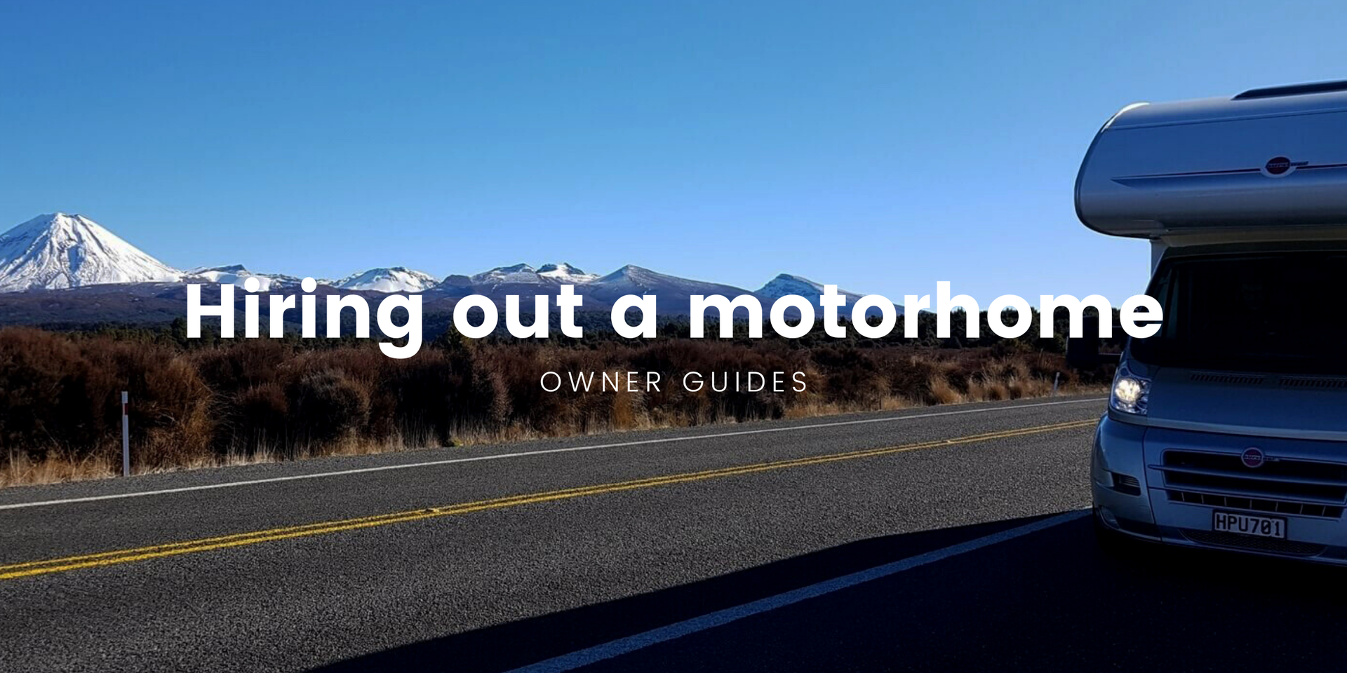 Motorhome parked up by a stunning NZ lake, ready for a Kiwi adventure.