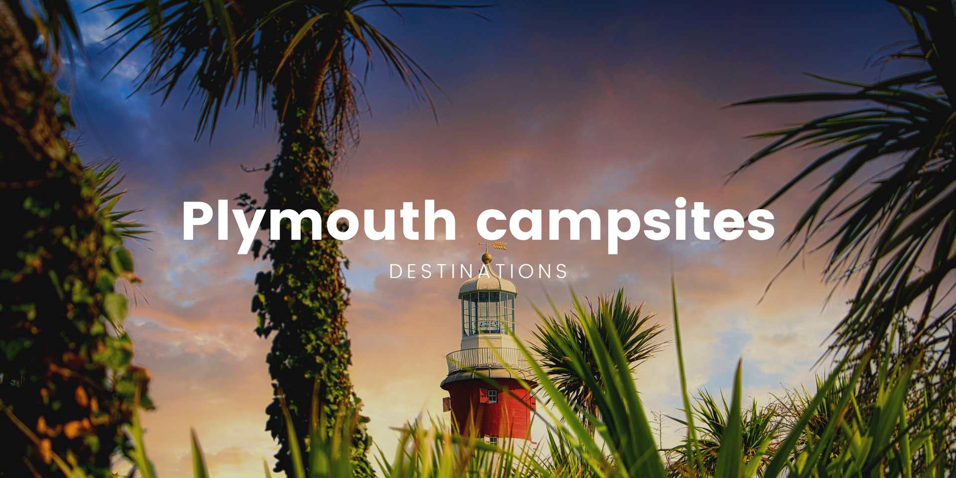 Tents pitched at Devon campsite, with Plymouth coastline visible in the distance.