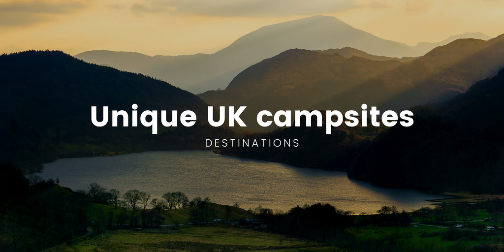 Scenic campsite in the British countryside, tents pitched amongst rolling green hills.