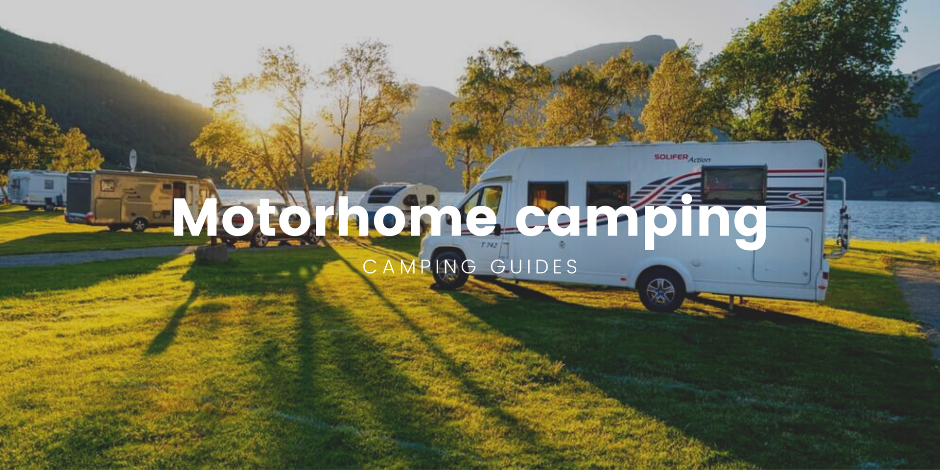 Motorhome parked up beside a scenic NZ lake, ready for a freedom camping adventure.