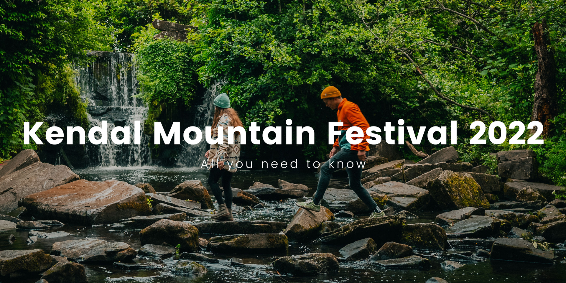 Tents pitched at Kendal Mountain Festival, set against a backdrop of the Lake District fells.