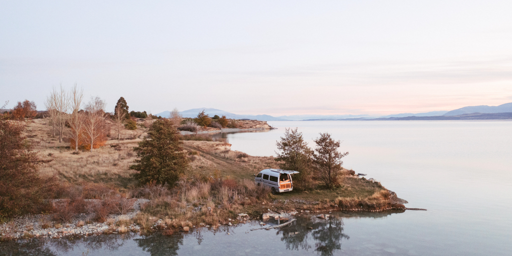 Team Zorali's campervan parked up in front of the Southern Alps, Aotearoa.