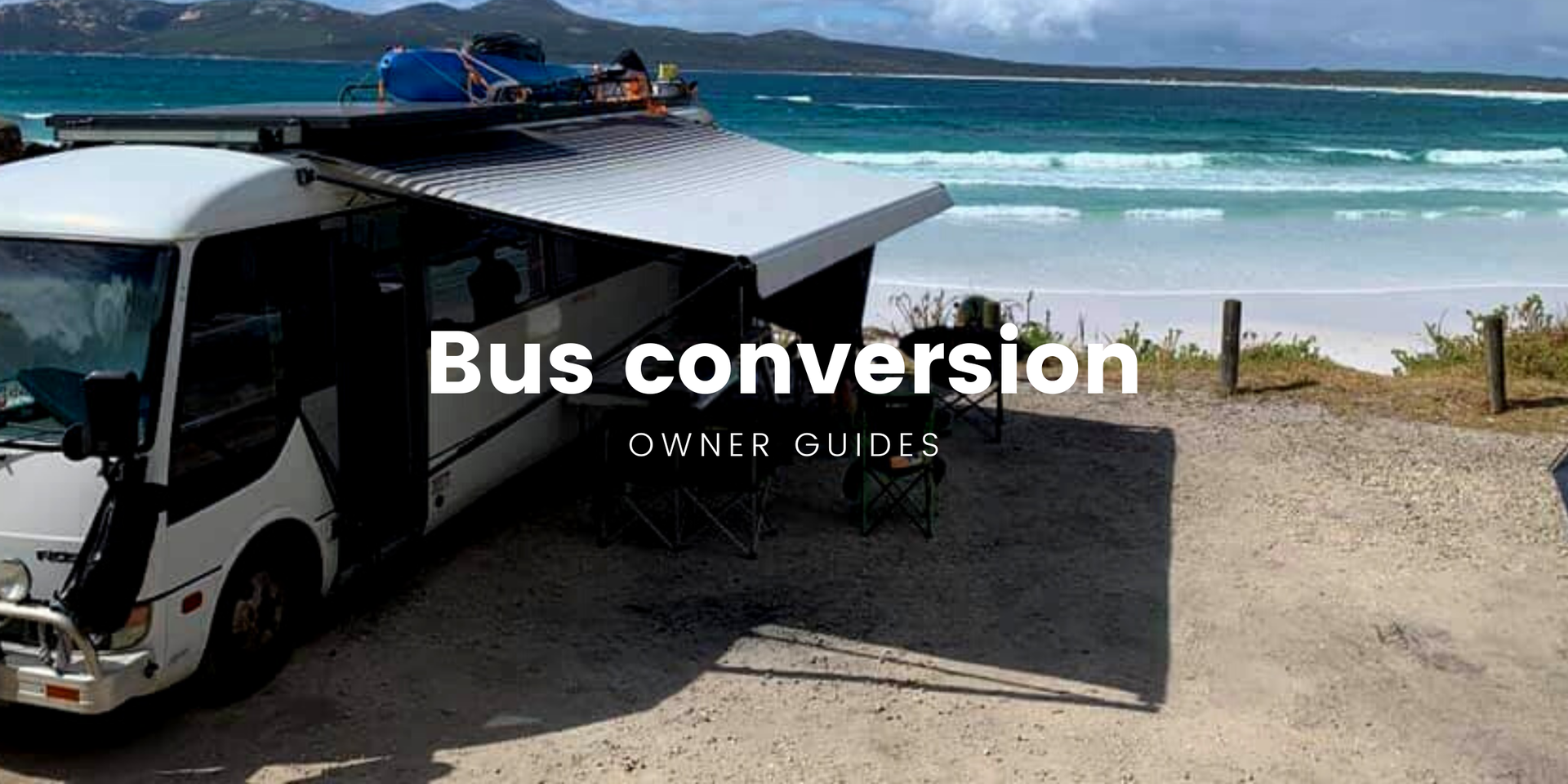 Kiwiana bus conversion parked up at a scenic camping spot, ready for adventure.