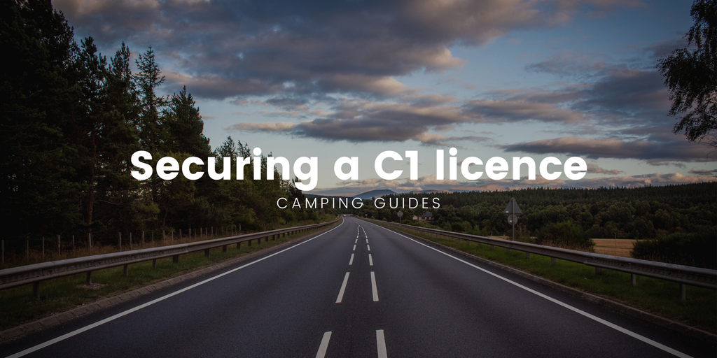 Motorhome parked on a grassy campsite, ready for a UK road trip adventure.