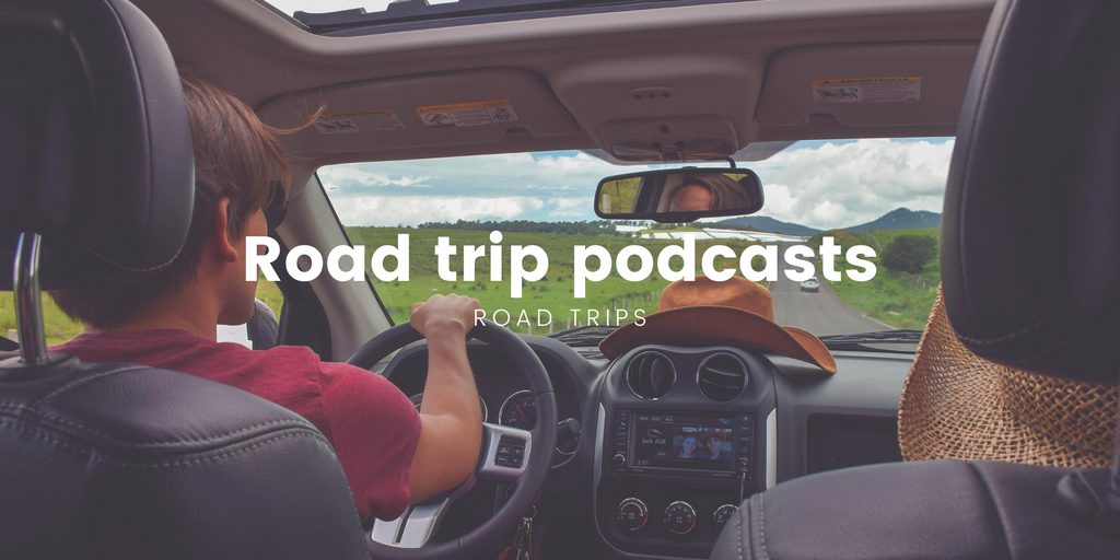 Couple toasting drinks outside a campervan on a sunny road trip, holiday in the countryside.