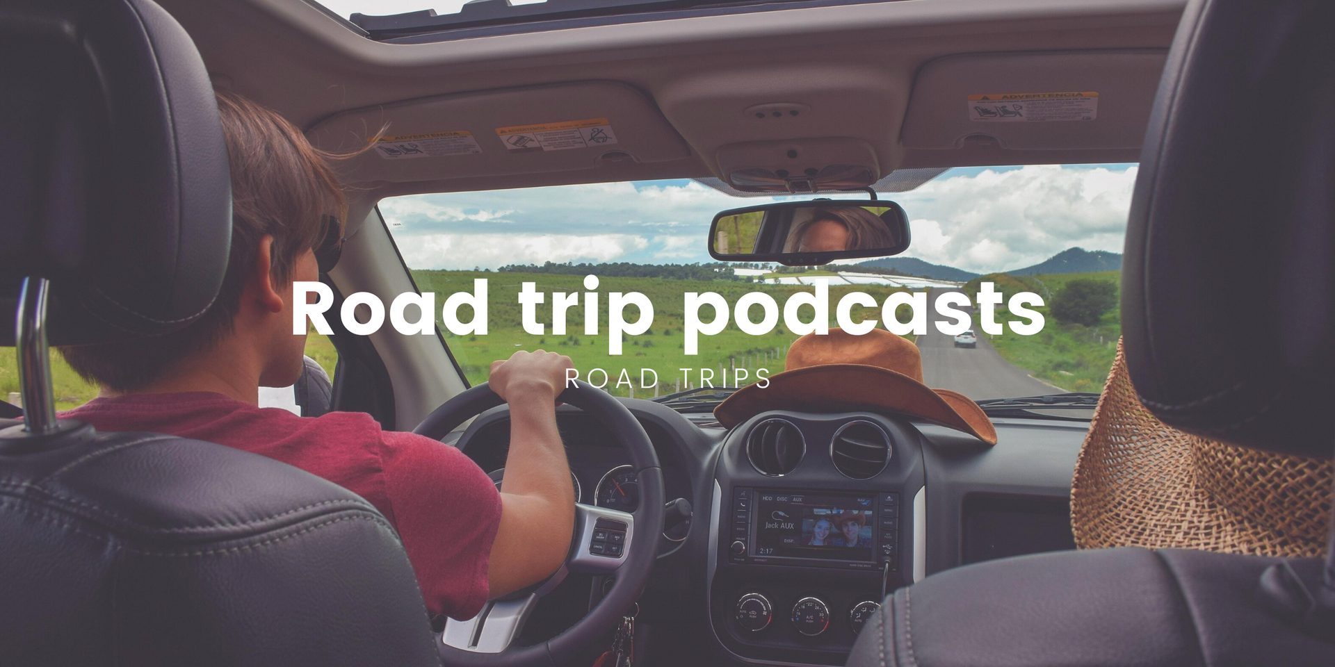 Couple toasting drinks outside a campervan on a sunny road trip, holiday in the countryside.