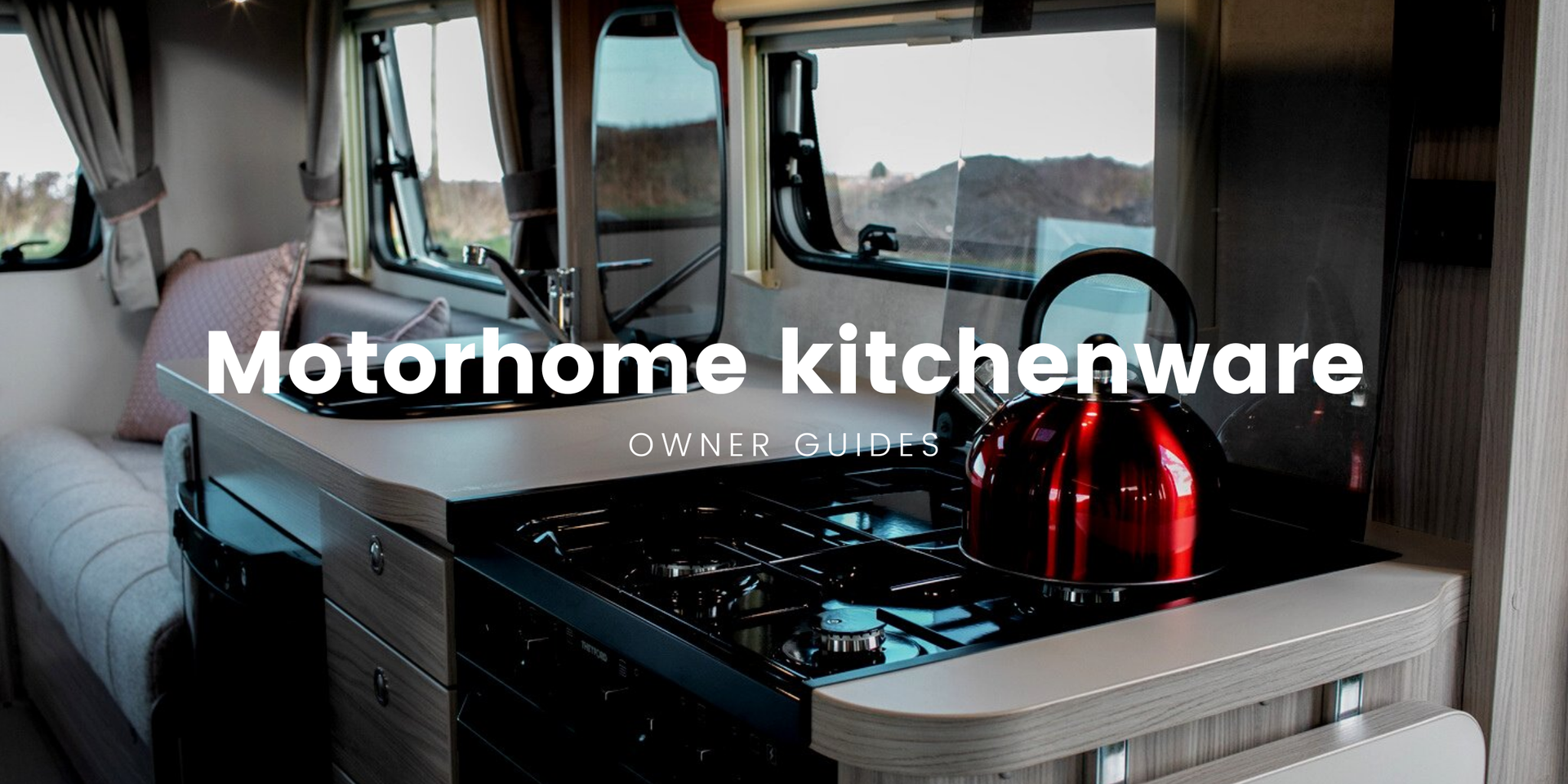 Motorhome kitchen with camping equipment, ready for a road trip adventure in the countryside.