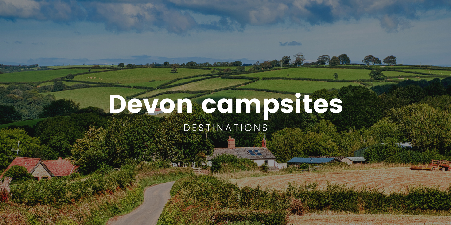 Campervan overlooking the Devon coast at a clifftop campsite. Coastal camping holiday.