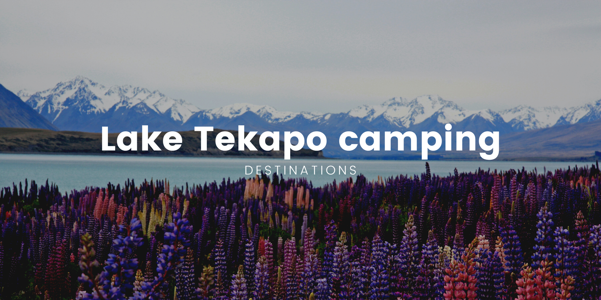 Campervan parked lakeside at Lake Tekapo, stunning mountain backdrop.