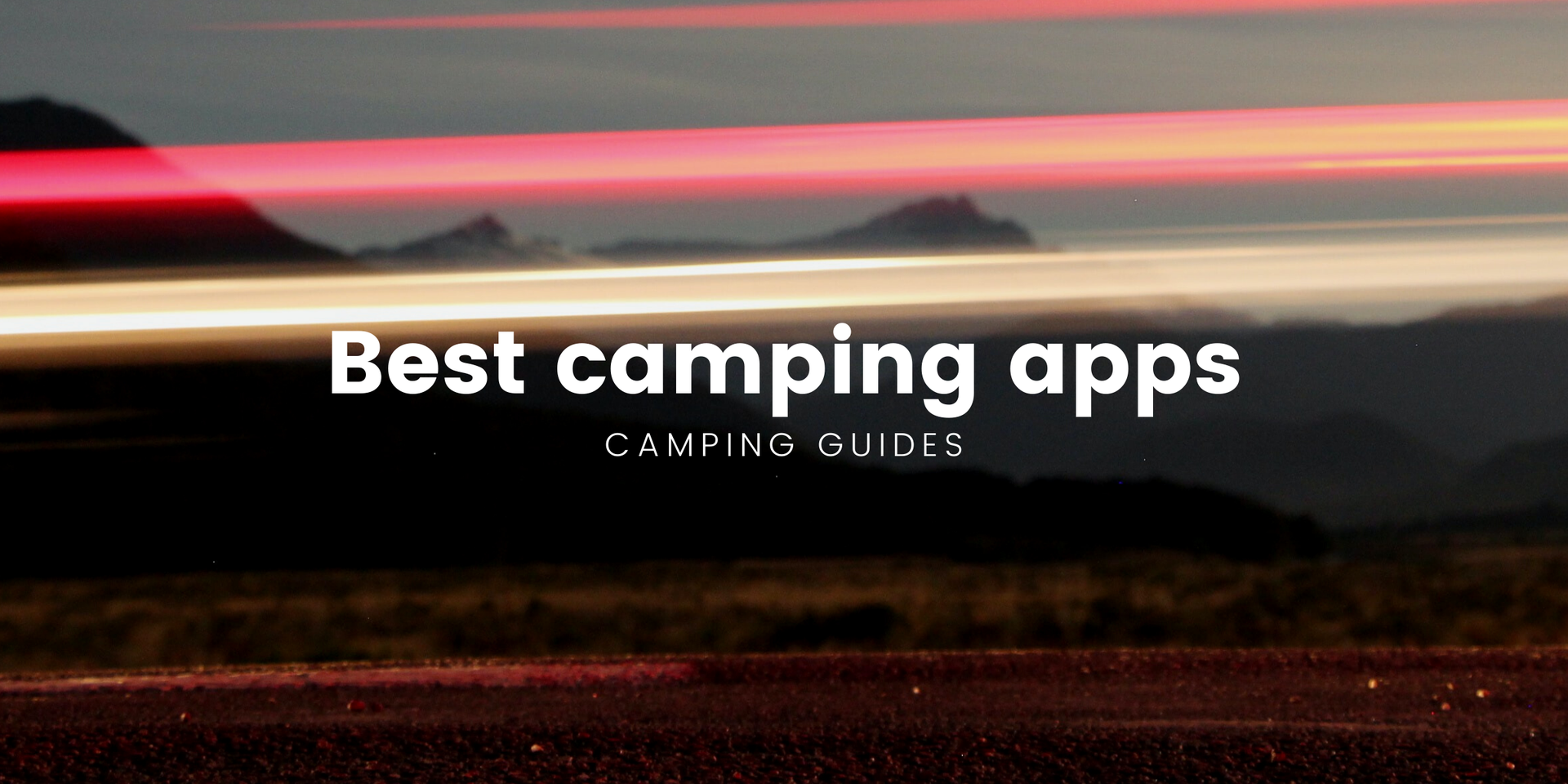 Tent pitched at a scenic campsite, with mountains in the background.