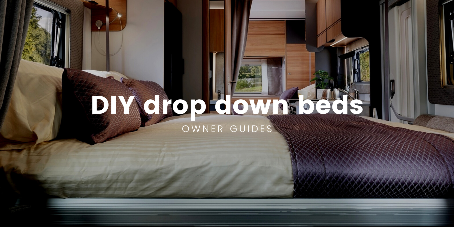 Campervan parked up at a scenic campsite, ideal for installing a DIY drop-down bed.