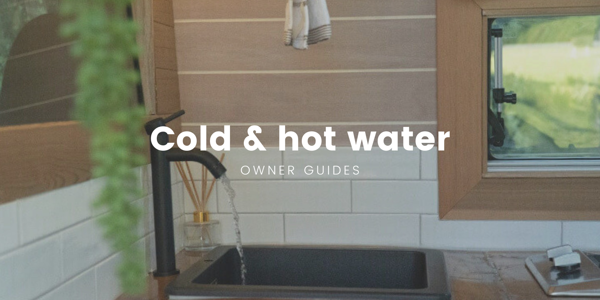 Campervan parked lakeside, ready for adventure with hot water system installed.