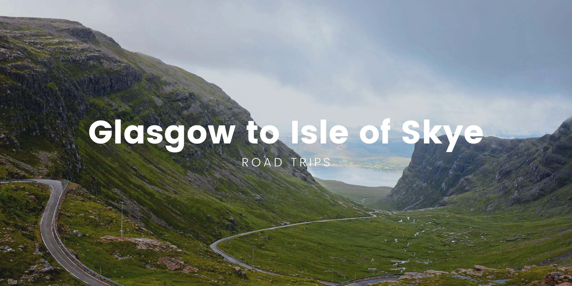Campervan parked on the Isle of Skye, with dramatic mountain scenery in the background.