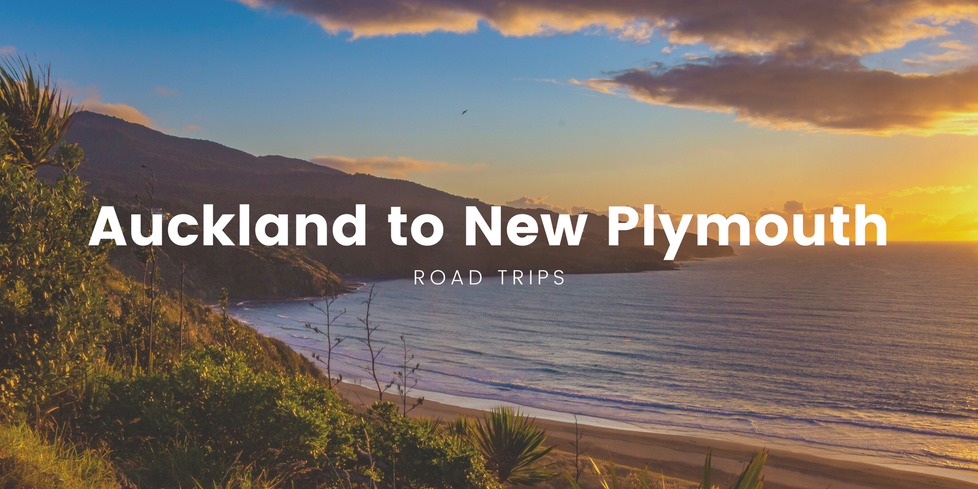 Campervan overlooking the rugged Taranaki coastline on an Auckland to New Plymouth roadie.