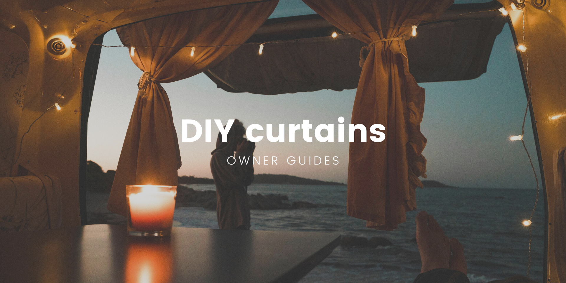 DIY campervan curtains inside a cosy self-contained camper at a scenic campsite.
