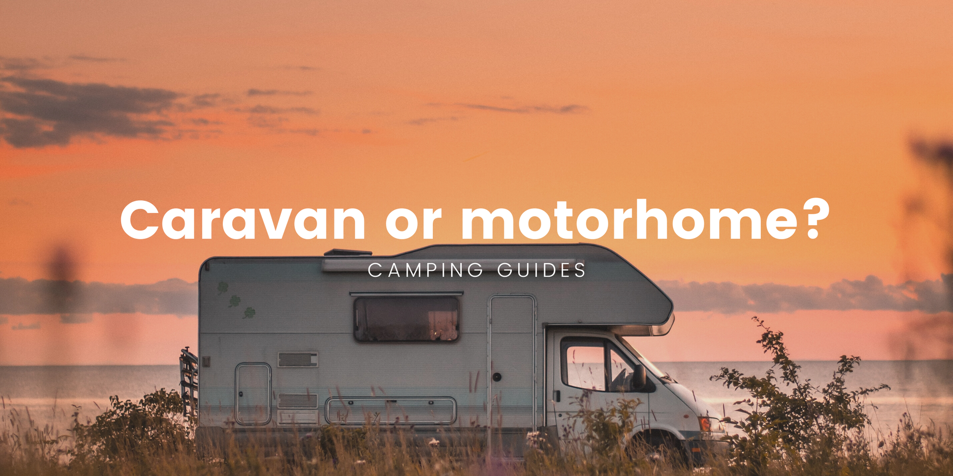 Caravan and motorhome parked up at a scenic campsite in the New Zealand countryside.