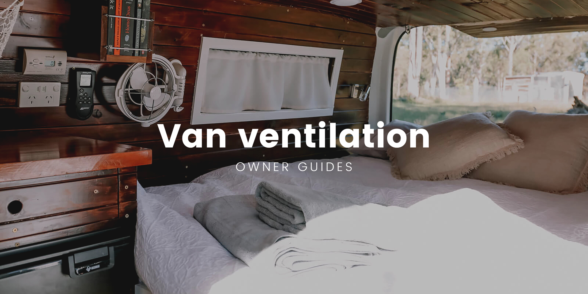 Campervan with roof vent parked at a beaut bush campsite.