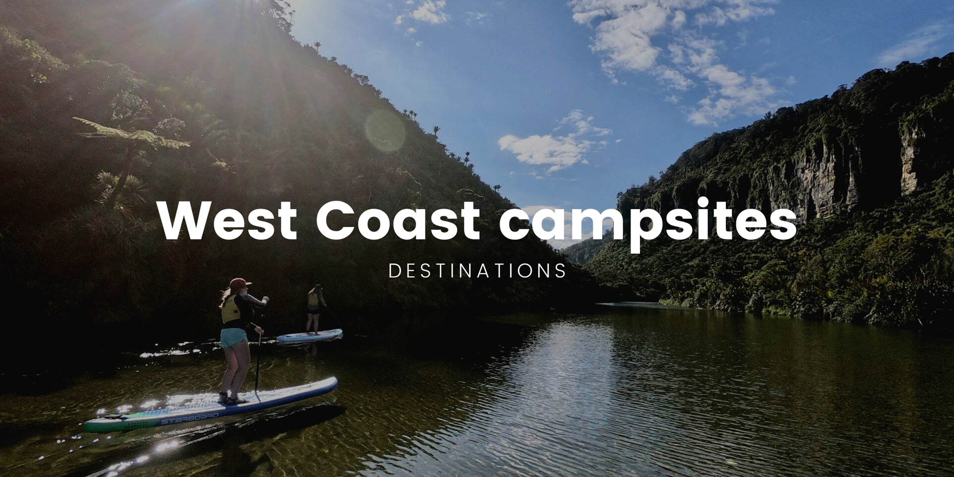 Tent pitched by a turquoise West Coast river, ready for a camping adventure.