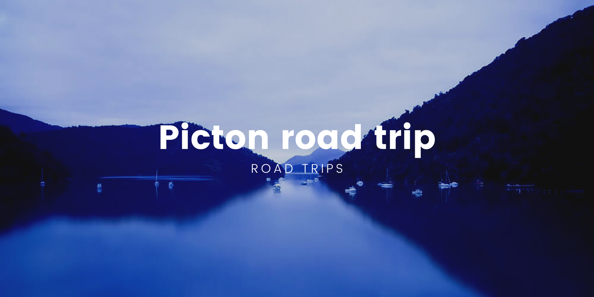 Campervan overlooking the Marlborough Sounds. Road trip adventures on the South Island, aye.