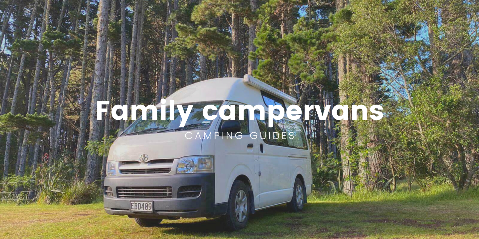 Family campervan holiday. Kids outside playing at a scenic campground with camper in background.