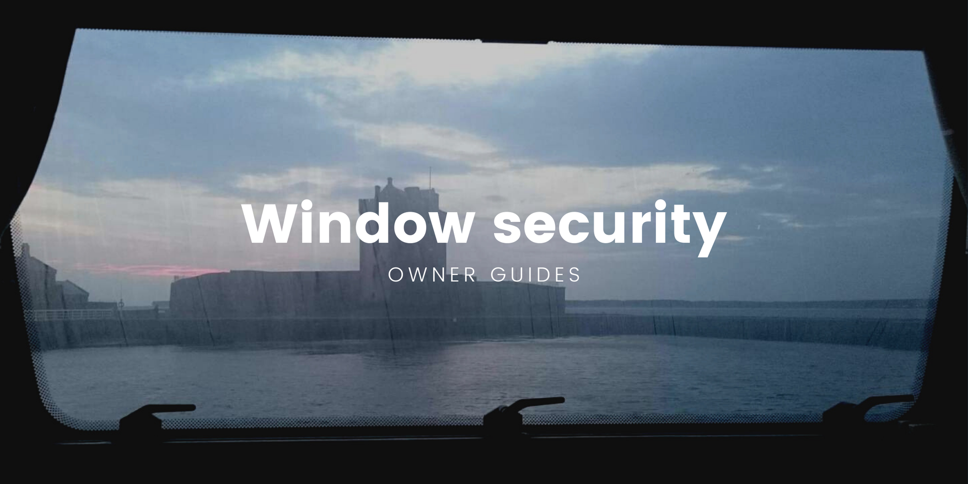 Motorhome parked up on a campsite, trees and blue sky in background.