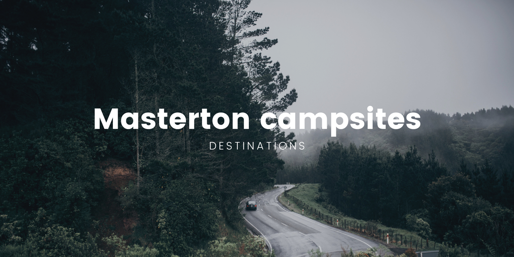 Tent pitched at a campsite in the Wairarapa countryside. Lush green hills in the background.