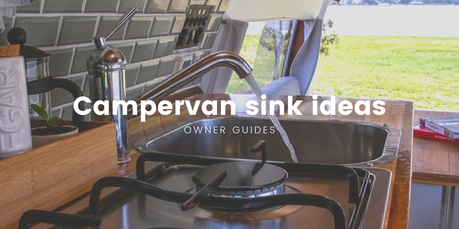 Campervan parked overlooking a scenic loch, ideal for a road trip adventure.