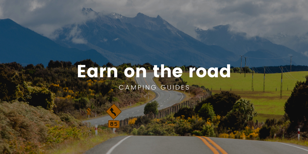 Campervan parked up at a scenic campsite, perfect for earning dosh on your roadie.