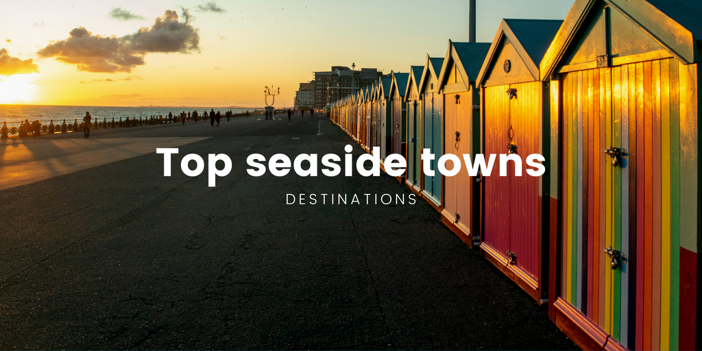 Campervan overlooking a sunny British coastline. Seaside holiday in a motorhome.