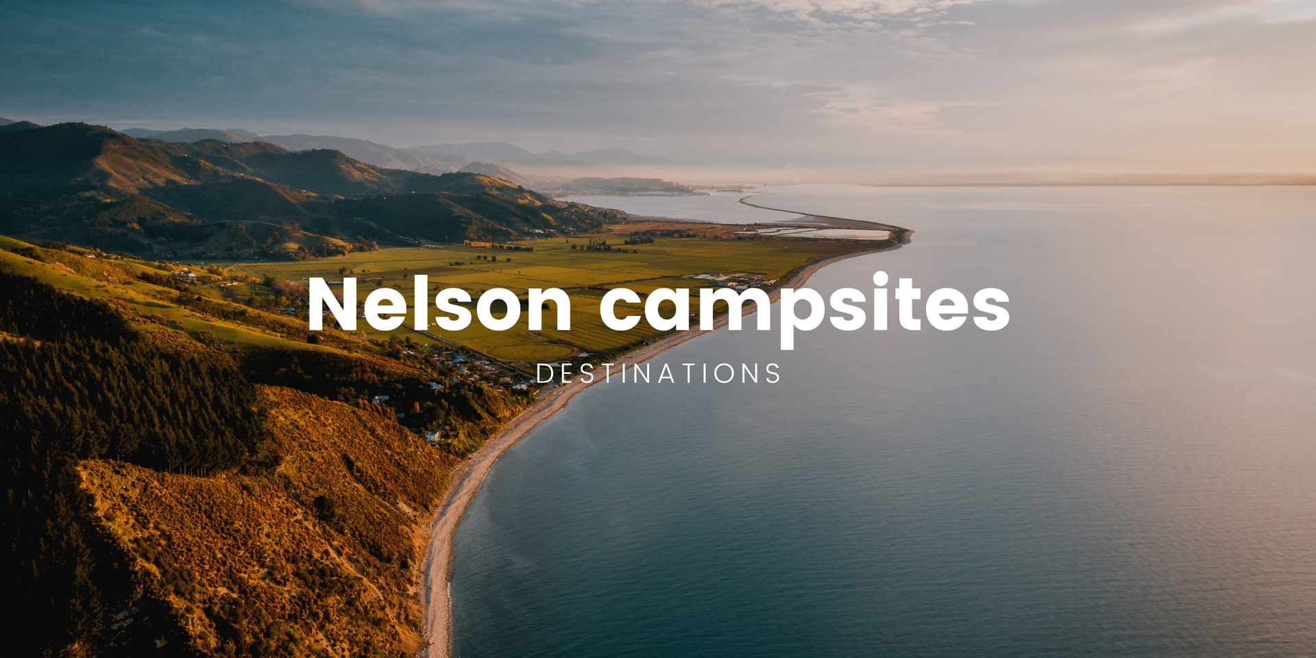 Tent pitched at a scenic Nelson campsite, with mountains in the background. Kiwiana summer holiday!