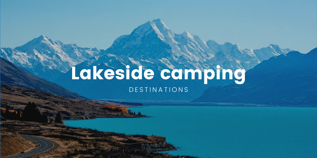 Tent pitched lakeside in a NZ camping ground, sun setting over the mountains.